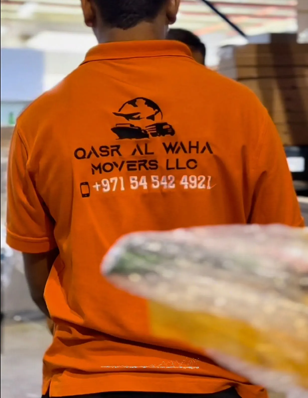 QASR AL WAHA Movers team wrapping furniture for a Dubai relocation