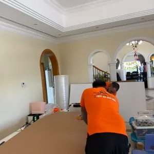 Office movers packing equipment in Dubai
